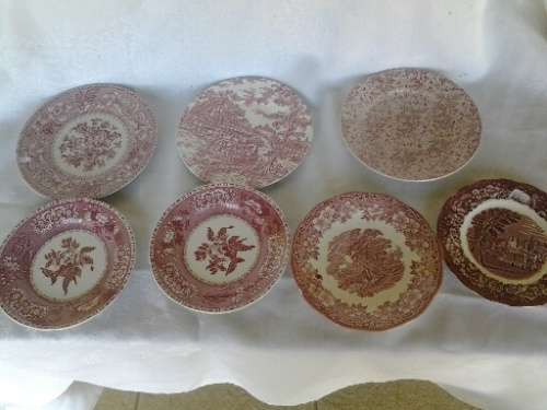 eight assorted pretty red and white porcelain side plates