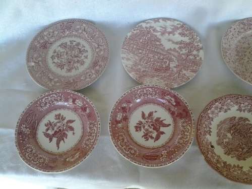eight assorted pretty red and white porcelain side plates