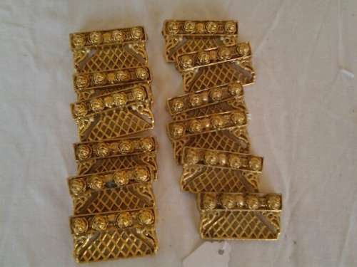 a set of gold plated looking pretty name place holders