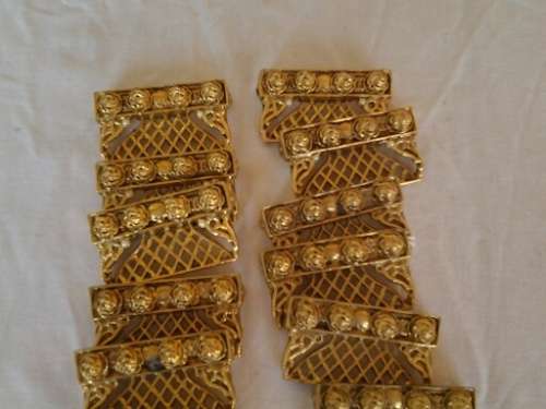 a set of gold plated looking pretty name place holders