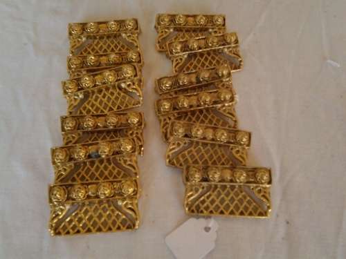 a set of gold plated looking pretty name place holders