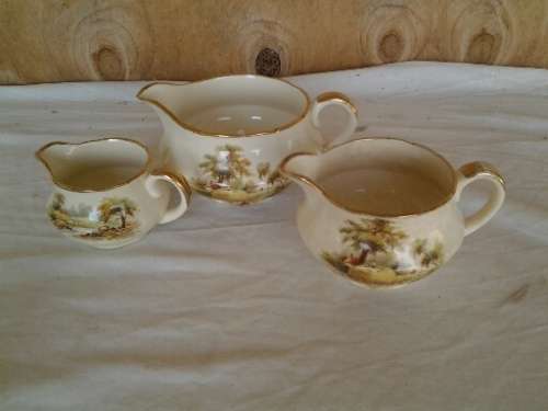 a set of three hayride pattern porcealin Alfred meakin cream jugs