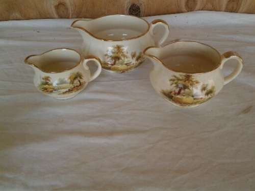 a set of three hayride pattern porcealin Alfred meakin cream jugs