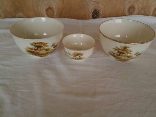 a set of three vintage hayride pattern porcealin sugar bowls