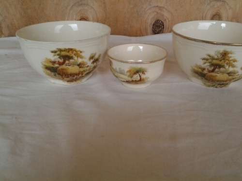 a set of three vintage hayride pattern porcealin sugar bowls