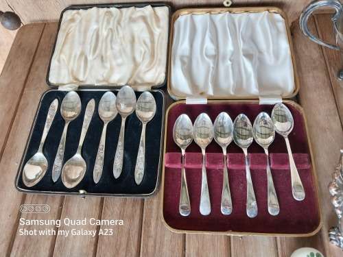 A lot of vintage sliver plated tea spoons ..tray ..tea strainer etc