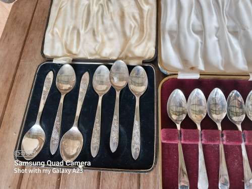 A lot of vintage sliver plated tea spoons ..tray ..tea strainer etc