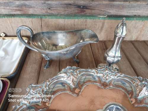 A lot of vintage sliver plated tea spoons ..tray ..tea strainer etc