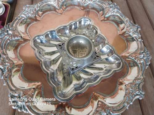 A lot of vintage sliver plated tea spoons ..tray ..tea strainer etc