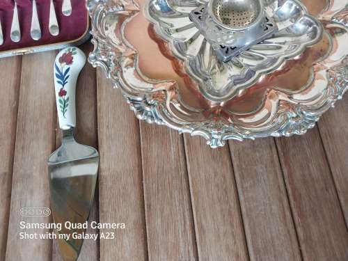 A lot of vintage sliver plated tea spoons ..tray ..tea strainer etc