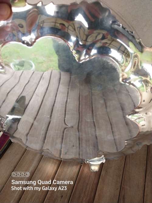 A lot of vintage sliver plated tea spoons ..tray ..tea strainer etc