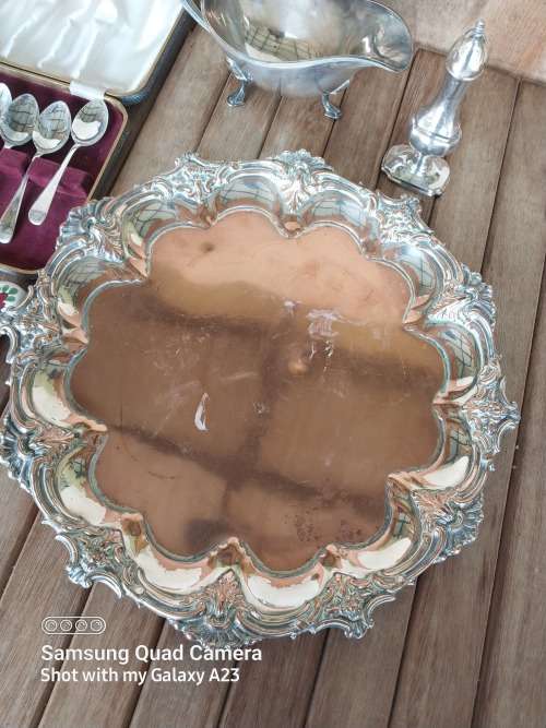 A lot of vintage sliver plated tea spoons ..tray ..tea strainer etc