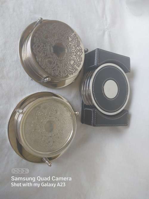 Three assorted  coasters  two sliver plated one leather