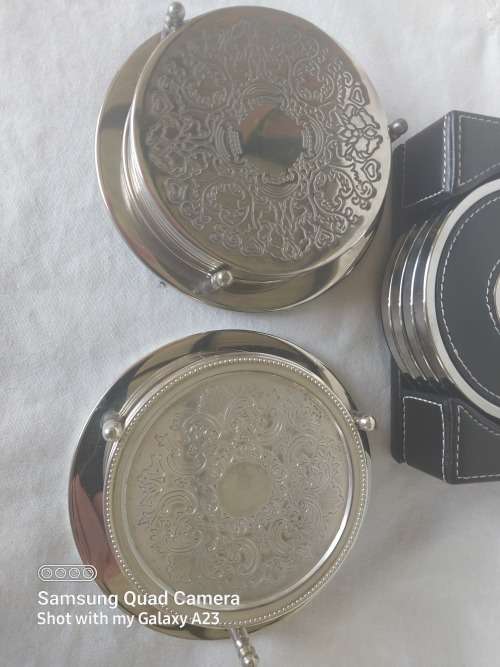 Three assorted  coasters  two sliver plated one leather