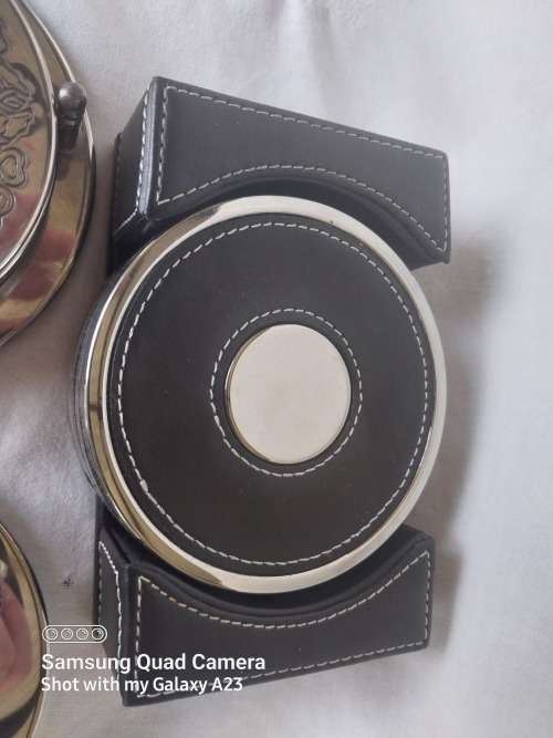 Three assorted  coasters  two sliver plated one leather