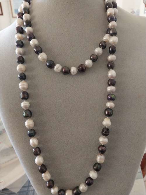 Long black and  white pearl necklace