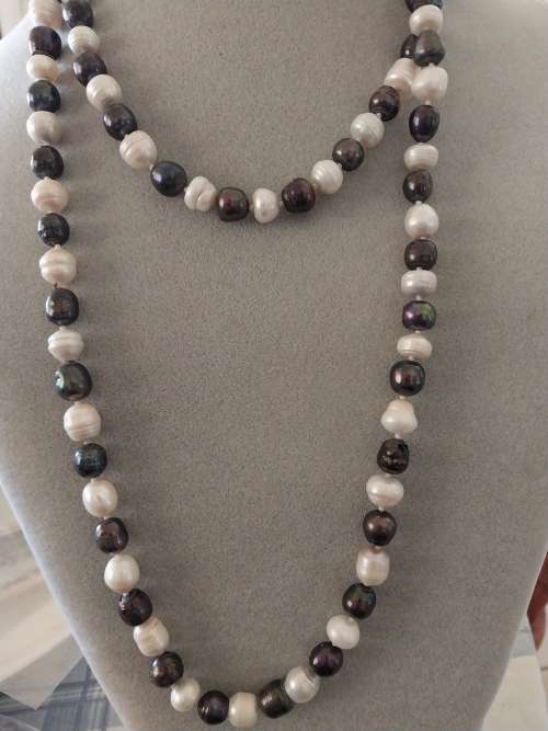 Long black and  white pearl necklace