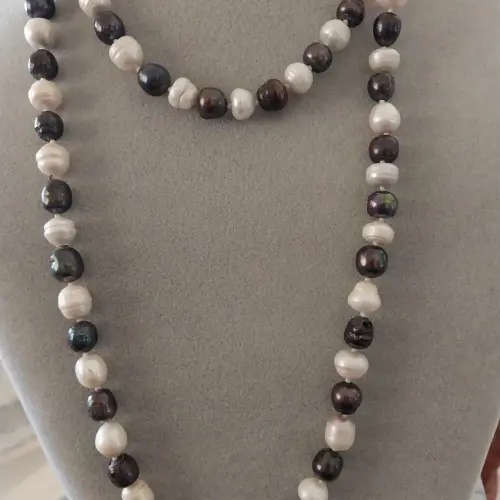 Long black and  white pearl necklace