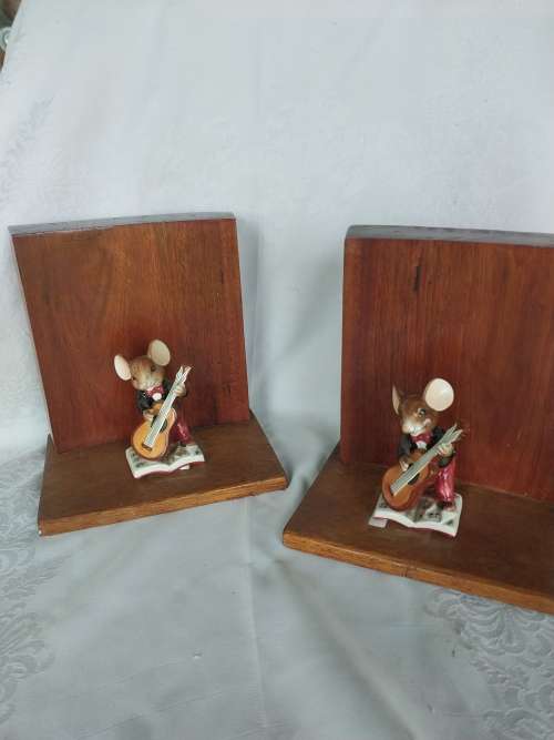 A pair of stunning wooden book ends with mouse figurines