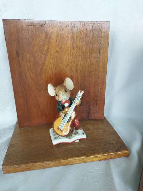 A pair of stunning wooden book ends with mouse figurines