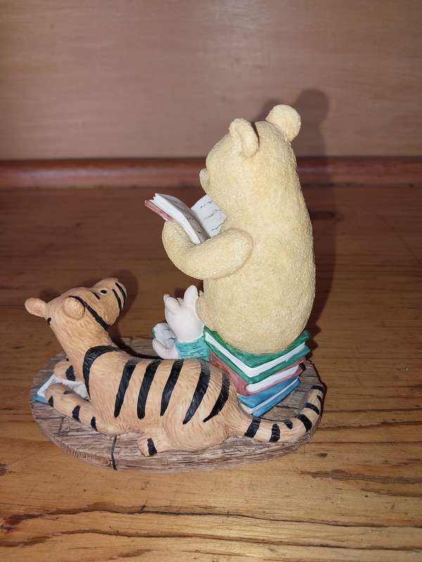 Collectable pooh bear reading ornament