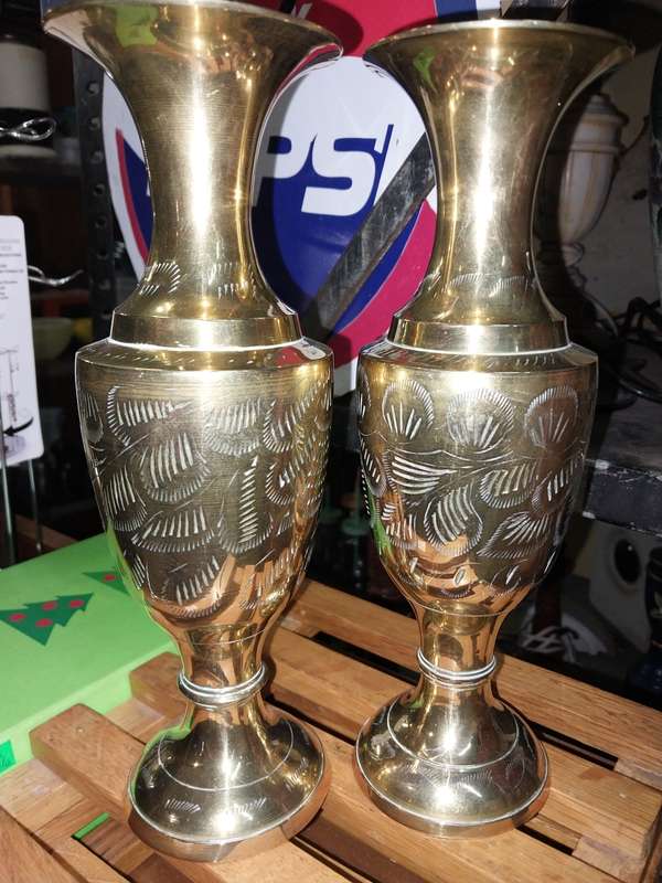 A pair of brass vases