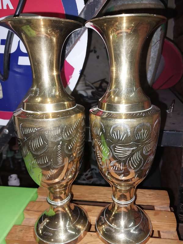 A pair of brass vases