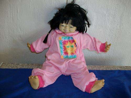A Chinese looking doll hard face and soft body mielera doll
