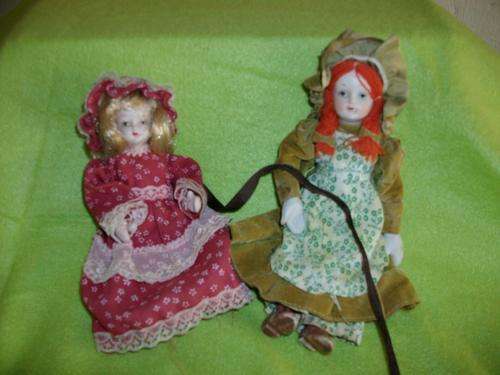 set of two old type porcelain dolls