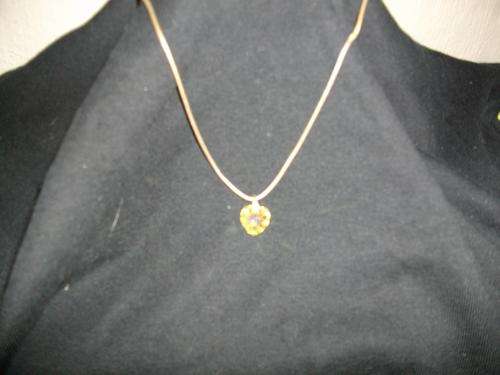 A gold plated necklace with crystal heart pendant