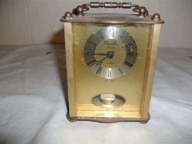 small battery opreated clock . needs repair