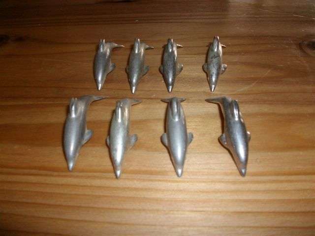 Lot of silver plated dolphin card holders ...??