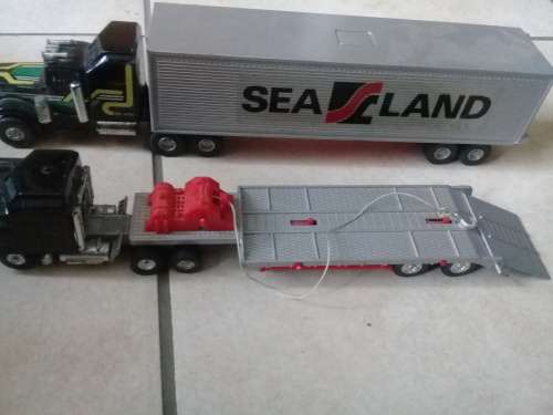 2 Articulated trucks, Sealand container truck and low loader