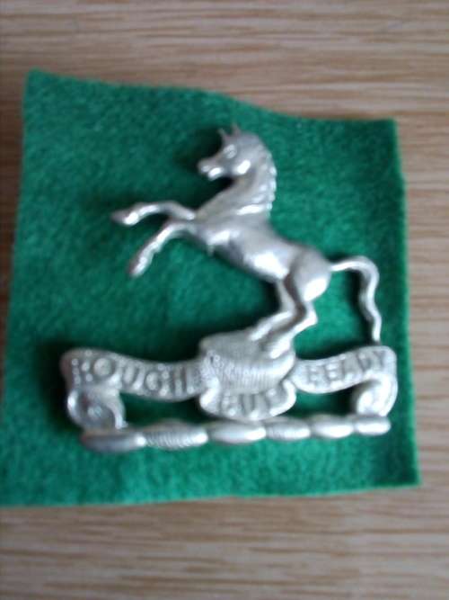 Natal Mounted Rifles WM beret badge with green backing