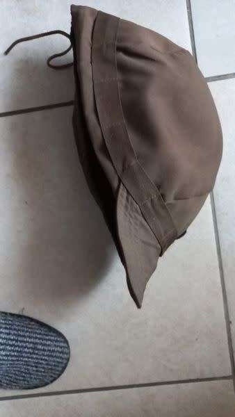 Helmet cover, small size, maybe Para. (Kevlar shown for size comparison.)