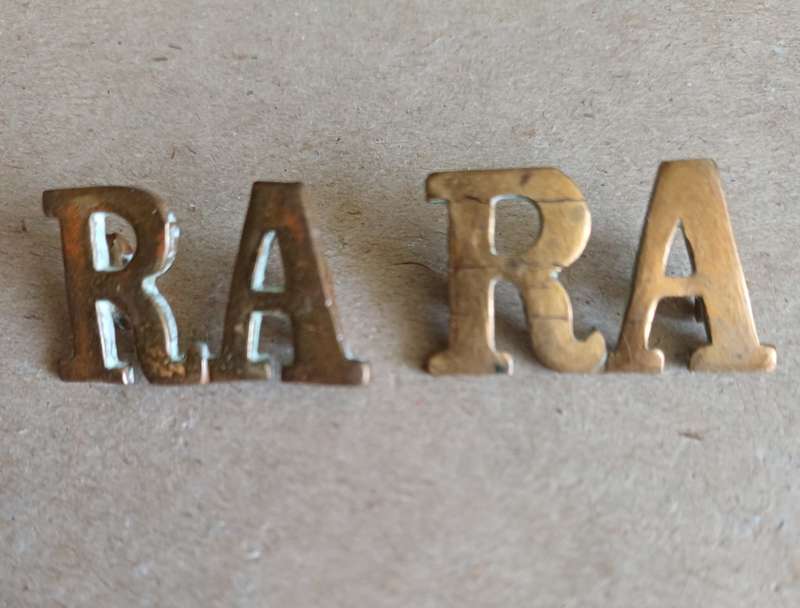 Royal Artillery brass titles with WWI D type lugs