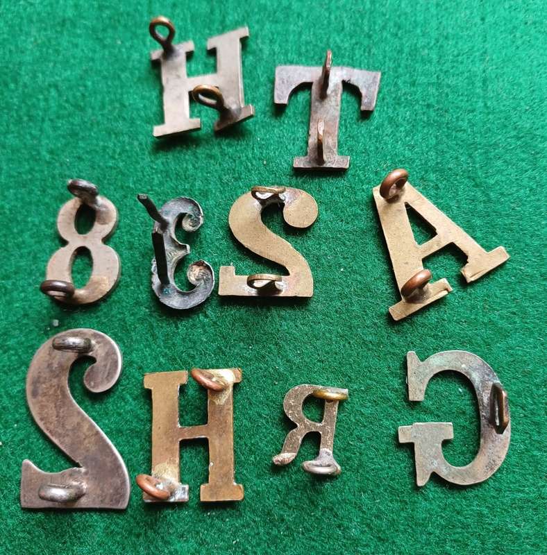 Selection of 10 Military brass & WM numbers and letters