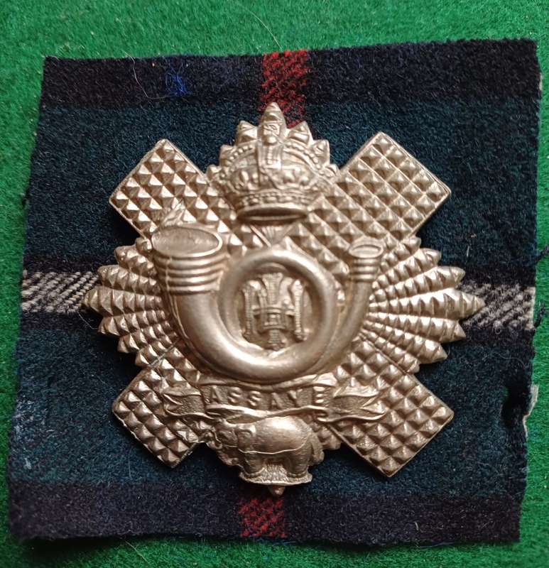 British Army, Highland Light Infantry headdress badge with tartan backing