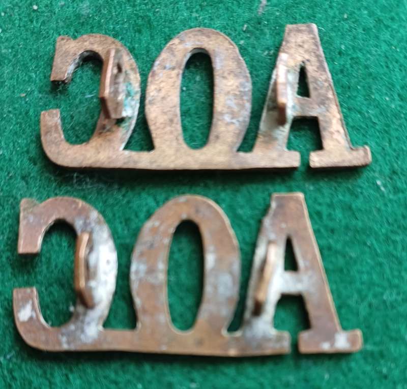 British Army Ordnance Corps brass titles pair, D lugs