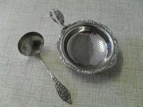 A DETAILED VINTAGE TEA STRAINER & HOLDER & A   N.S SUGAR SPOON