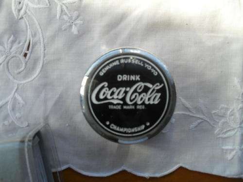 A  SILVER AND BLACK COLOURED GENUINE RUSSELL, COCO COLA CHAMPIONSHIP YOYO