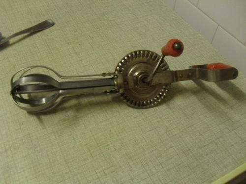 A VINTAGE BLUE WHIRL STAINLESS STEEL HAND MIXER