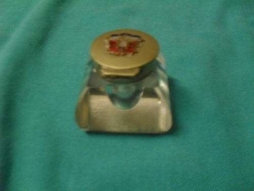 VINTAGE BRASS AND GLASS CRESTED INKWELL