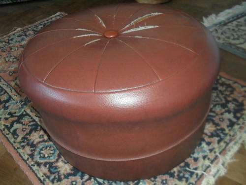 (27)  A VINTAGE POUFFE FOOTSTOOL - polystyrene and sponge 23cm across 40cm high