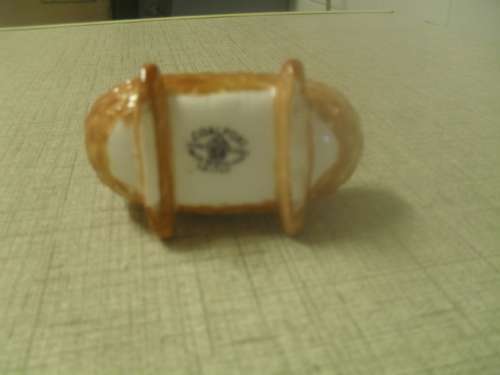 *# A VINTAGE BONE CHINA MINIATURE COALPORT CRADLE NO. AD1750