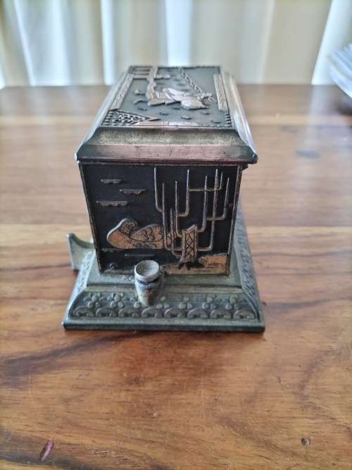 R30*## AN ANTIQUE METAL JAPANESE CIGARETTE DISPENSER - still dispenses