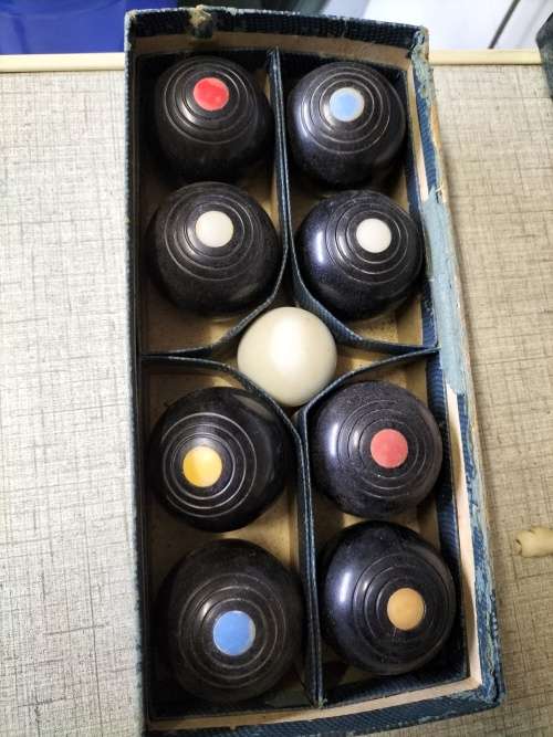 A VINTAGE  CARPET BOWLS SET