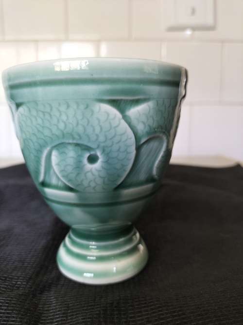 A CERAMIC JADE COLOURED CALEDON LIKE, GOBLET.- NO MARKINGS.