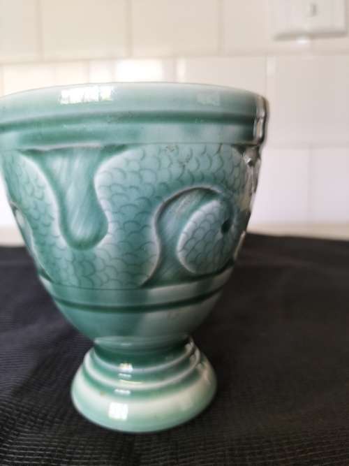 A CERAMIC JADE COLOURED CALEDON LIKE, GOBLET.- NO MARKINGS.