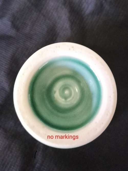A CERAMIC JADE COLOURED CALEDON LIKE, GOBLET.- NO MARKINGS.